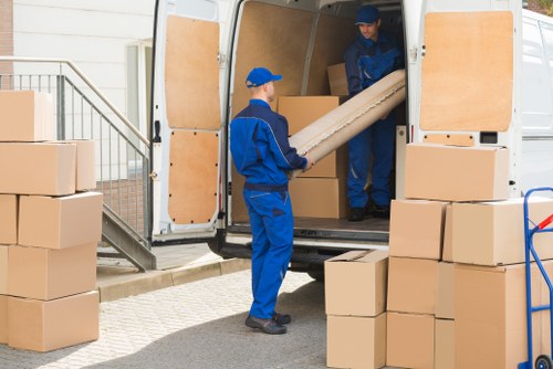 Professional movers handling household items