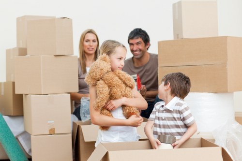 Professional movers packing items into Jimmy's Removals truck