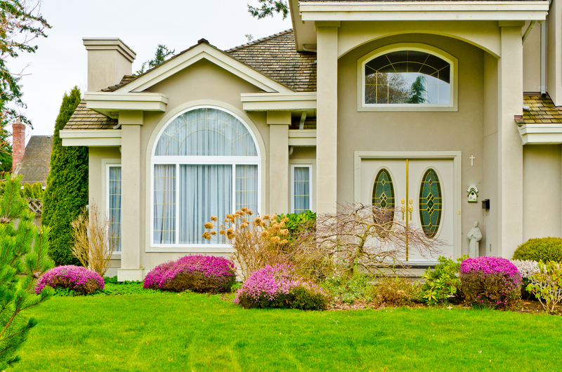 Electric low-emission removal van parked outside a property during a collection